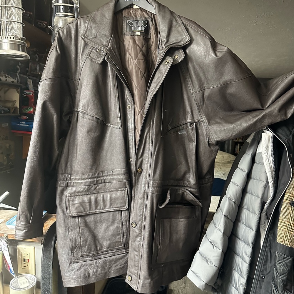 This is a Antonio Giovanni thigh length leather coat